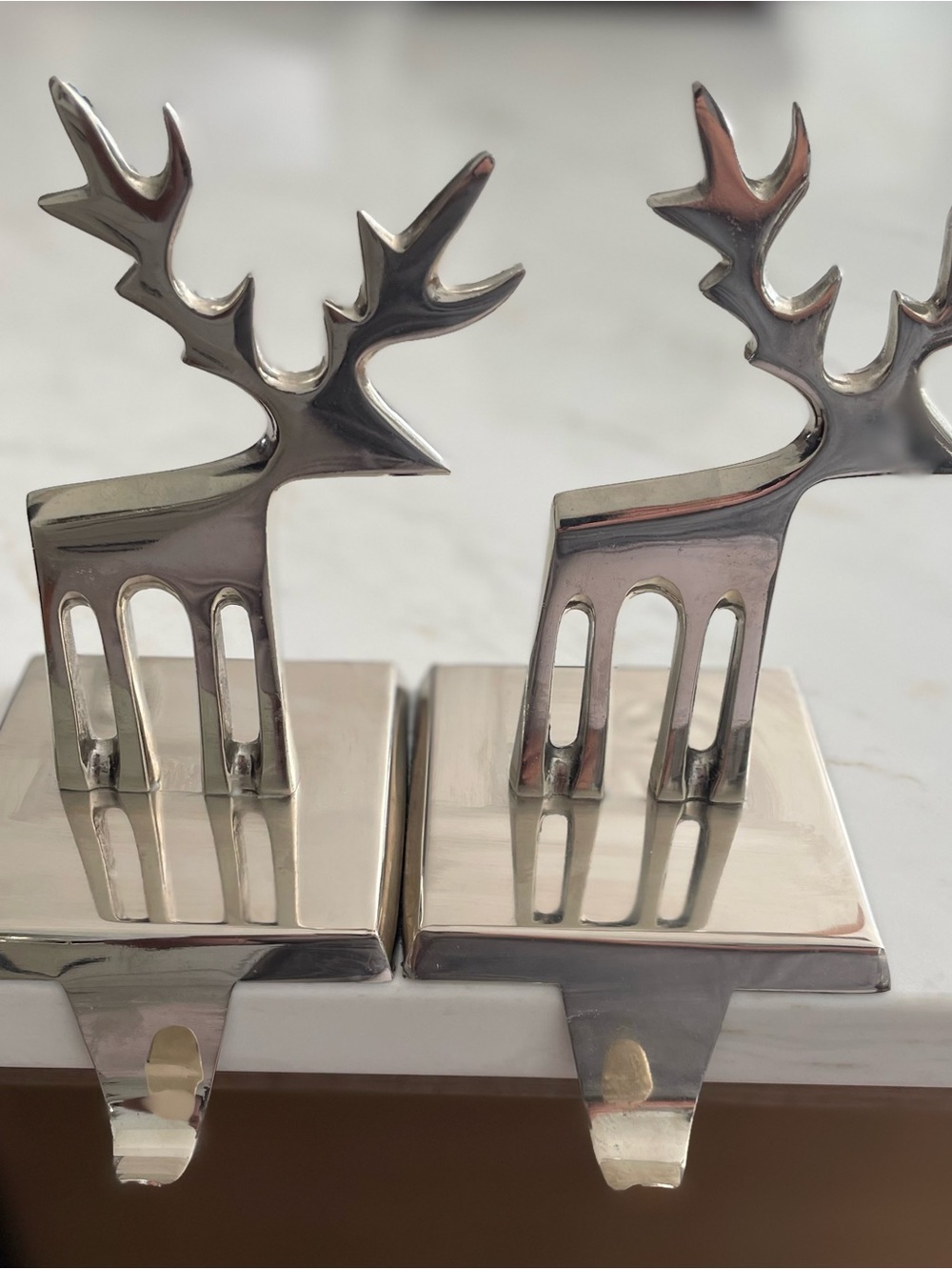 Crate & Barrel pair of reindeer Christmas stocking holders.